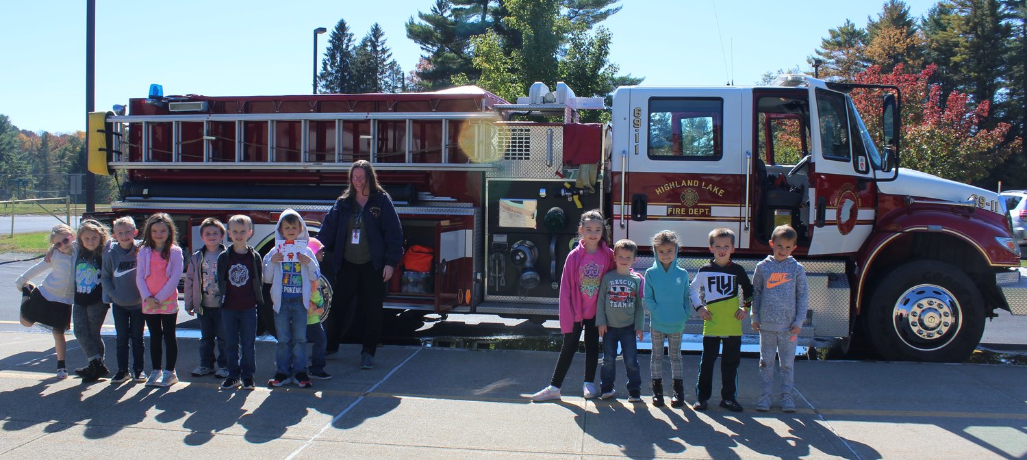 First graders met with firefighters and EMTs as part of their Fire Prevention Week curriculum.